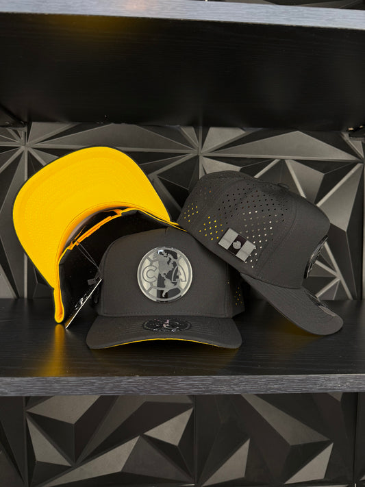 América SnapBack Gorra-Negra/Amarilla hydro